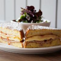Monte Cristo Sandwich · bacon, smoked turkey, scrambled eggs, strawberry jam between powdered french toast slices. s...