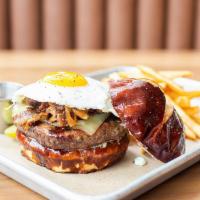 Roadshow Burger · candied bacon, sunny egg, pepper jack, pretzel bun, garlic mayo, bourbon onions
