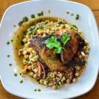 Crispy Half Chicken · 24-hour brined + deep fried, served w/ moroccan broth, garbanzo beans, cous cous