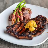 Ribeye · your choice of: garlic butter, cajun butter, or simply grilled. served w/ bacon wrapped aspa...