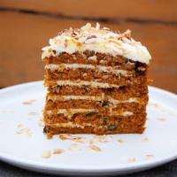 Colossal Carrot Cake Slice · 6 layers, cream cheese filling, whipped cream, pecans, pineapples