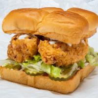 Bad Mutha Clucka Chicken · Crispy beer batter fried or grilled chicken tenders, lettuce, pickles, and miso ranch. Serve...