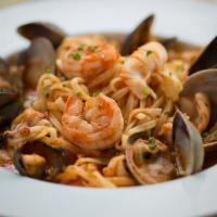 Seafood Pasta · Shrimp, mussels, clams, calamari, basil tomato sauce.