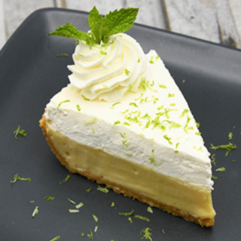 Key Lime Pie · creamy Florida Key Lime custard, graham cracker crust + whipped cream