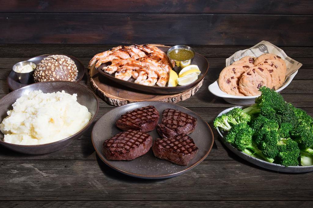 Surf & Turf Family Meal · Four 8 oz. top sirloin center-cut, fire-grilled jumbo shrimp, home-style mashed potatoes or 5-grain rice pilaf, fresh broccoli with garlic butter, and eight chocolate chip cookies. *All steaks cooked to the same temp
