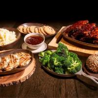 BBQ Family Meal · 4 fire-grilled chicken breasts smothered in our smoky molasses bbq sauce, bbq baby back ribs...