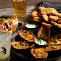 Loaded Potato Skins · Loaded with Jack and Cheddar cheeses, bacon, sour cream and green onions.