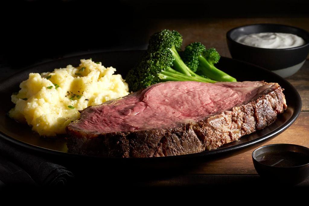 USDA Choice Prime Rib  · Seasoned with our Black Angus dry rub, seared and roasted to perfection. Served to order with rich, house-made au jus and your choice of fresh or creamy horseradish sauce.