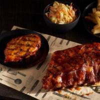 BBQ Chicken & Ribs · A grilled chicken breast and a half rack of baby back ribs both smothered in our smoky molas...