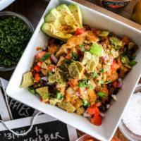 Black Bean Energy Bowl · Potatoes, green peppers, and onions, tofu, black bean salsa, avocado, drizzled with house-ma...
