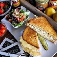 Gocha’s Tuna Melt · Delicious house albacore tuna salad on grilled multigrain bread with swiss cheese, garnished...