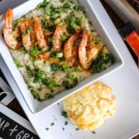 Shrimp and Grits · Sautéed shrimp in Gocha’s tasty creamy herb sauce served over rich creamy grits garnished wi...