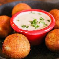 Fowl Balls · new orleans-style dirty rice balls fried and served with white bbq sauce