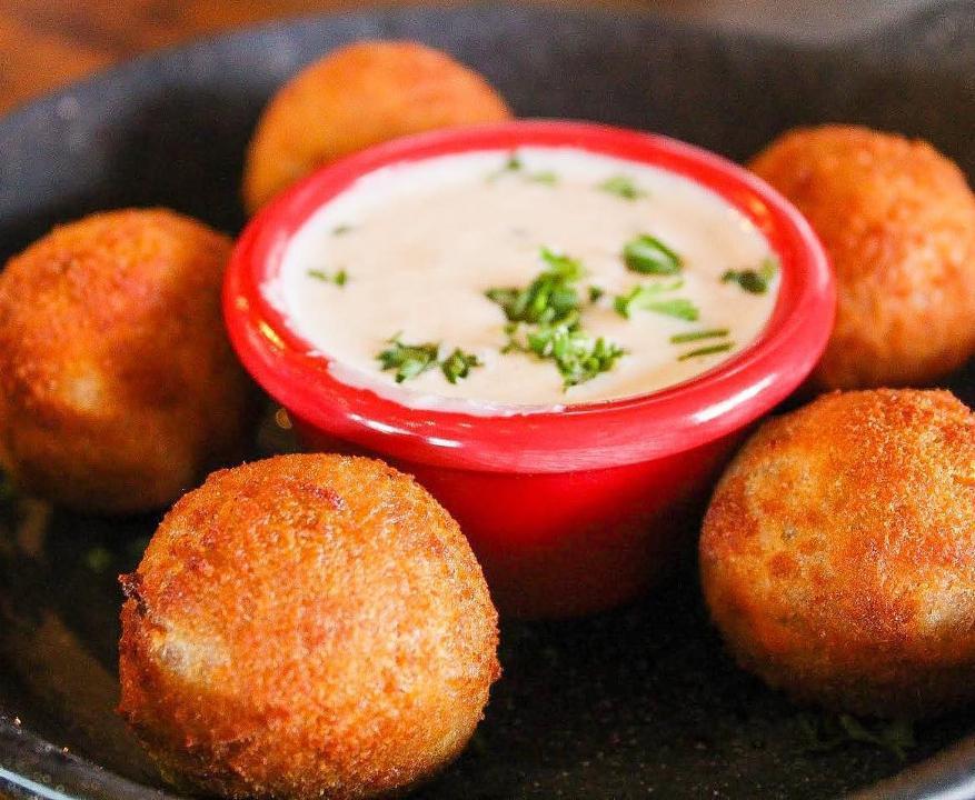 Fowl Balls · new orleans-style dirty rice balls fried and served with white bbq sauce