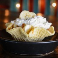 Banana Pudding · scratch-made banana pudding served in a waffle bowl, topped with sea salt caramel and whippe...