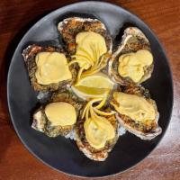 Fresh Oysters · Rockefeller: Baked Oysters on the half shell, topped with creamy spinach and bacon, herb ble...
