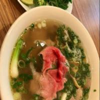 N2. Eye Round Steak Noodle Soup · Served with beansprouts, basil, green onions, cilantro, jalapeno, limes and dressing for pho.