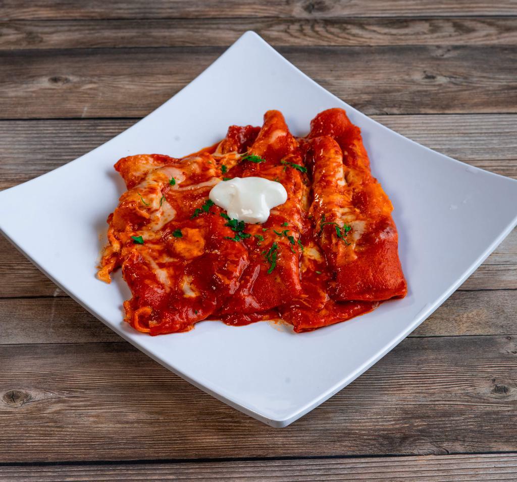 Baked Cheese Enchiladas · Lightly topped with cheese, red green or Spanish sauce. Served with sopapillas with honey.
Served with Spanish rice and Refried beans