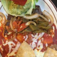 17. Tampiquena Top Sirloin Steak · Grilled and smothered with strips of long green chile, tomatoes, onions, and served with 1 c...