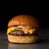 Award Winning Cheeseburger · CLASSIC. Fresh ground beef seared and served with American cheese, grilled onions, pickles a...