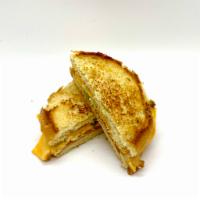 Grilled Cheese · American Cheese, scallions, and homemade ranch on an griddles inside out brioche bun.