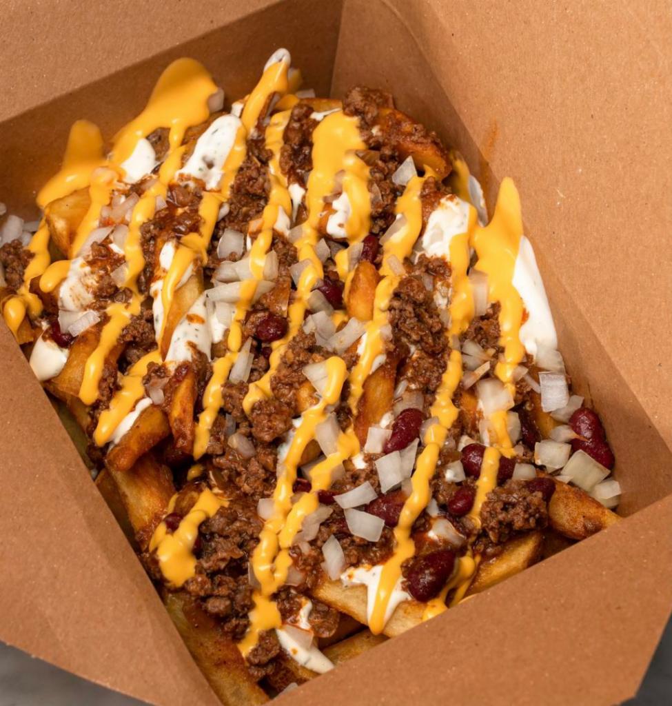 Loaded Fries - Nacho Chili · TEXAS BORN. Homemade Chili with sour cream ranch, fresh onions pickles and parmesan cheese on 12oz. of HF Signature fries.