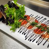 Caprese Salad · Fresh mozzarella, Roma tomatoes, basil, balsamic reduction.