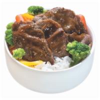 BBQ Beef Bowl · Served with steamed vegetables and rice in bowl.