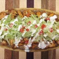 Huarache · Choice of meat, beans salsa, lettuce, crema, cotija and tomato.