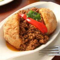 Papa Rellena-Stuffed Potato · Mashed potatoes filled with ground beef. Breaded and golden fried to perfection.