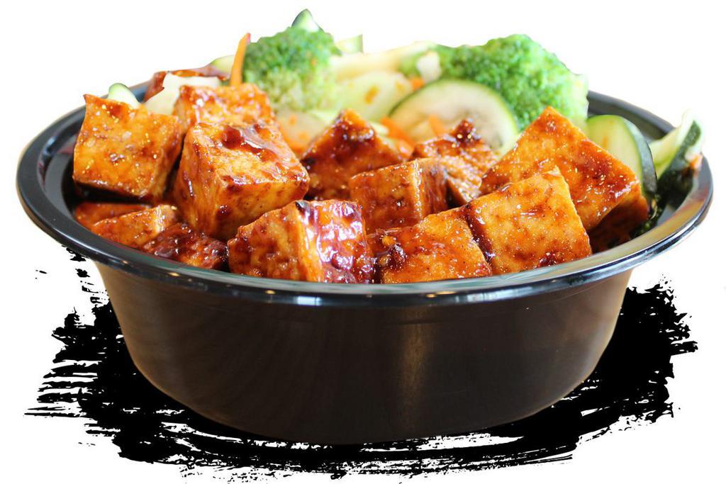 Mad Spicy Tofu · Crisp tofu on the outside, soft on the inside. Our Spicy Tofu is amazing, but you have to try this new MAD SPICY tofu wok-tossed with our new MAD SAUCE! Piled over your choice of white rice, brown rice, fried rice or noodles and includes stir-fry veggies! Even carnivores will love it!
