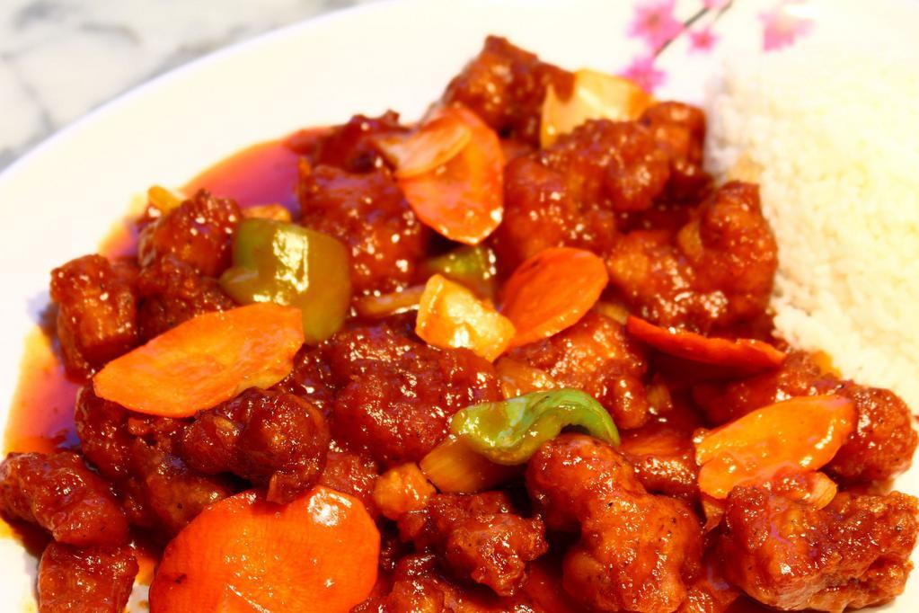 12. Sweet and Sour Chicken · Deep-fried chicken sautéed in sweet&sour sauce w/onions, green peppers &carrots.
