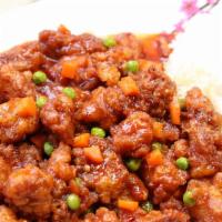 13. General Tao's Chicken · Fried chicken sautéed in a sweet and spicy sauce w/peas and carrots