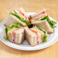 The Island Club Sandwich · Triple decker, turkey, ham, bacon, mayo, lettuce, tomato, American and provolone on your cho...