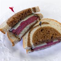 Reuben Sandwich · Pastrami, sauerkraut, melted swiss, your choice dijon or thousand island dressing on toasted...