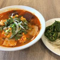 Bun Tom Cua Hue · Shrimp and crab cake spicy noodle soup with pork & blood cubes.