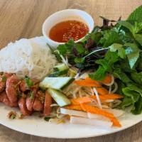 Nem Nuong · Grilled pork meatball served with rice sheet, vermicelli, vegetable and hoisin peanut sauce.
