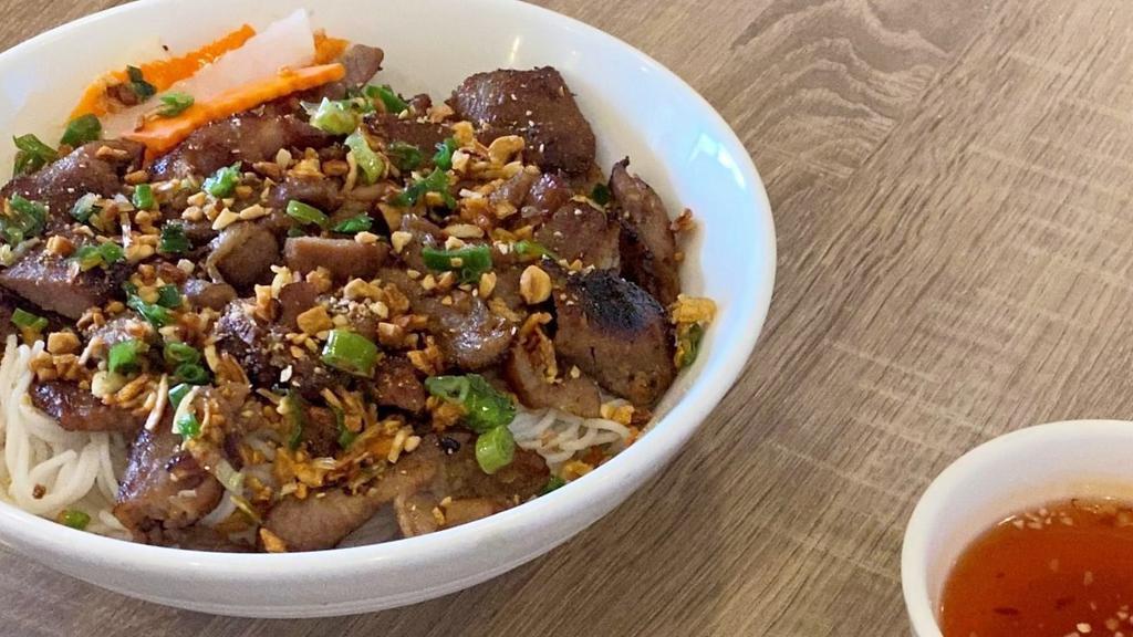 Bun Thit Nuong · Grilled sliced pork over vermicelli and vegetables.