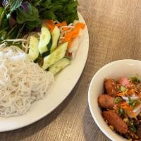 Bun Cha Ha Noi · Hanoi style grilled pork served with vermicelli and vegetables.
