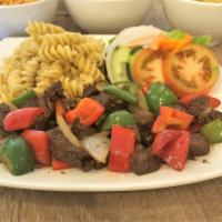 Nui Xao Bo Luc Lac · Stir-fried filet mignon beef cubes with garlic pasta and vegetables.
