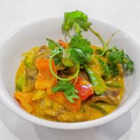 Red Curry · Onions and bell peppers slowly cooked in spicy red curry. Served with steamed or fried rice....