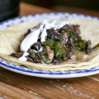 Hongos Taco · Sauteed mushrooms, onions and poblano peppers with crema fresca.