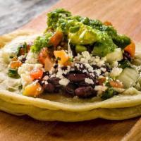 Aguacate con Queso Taco · Avocado, queso fresco, black beans, pico de gallo and salsa verde.