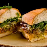 Carne Enchilada Torta · Pork enchilada, cabbage, salsa verde and cilantro. Traditional Mexican street sandwiches ser...