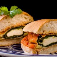 Chile Relleno Torta · Roasted poblano pepper stuffed with queso,topped with a light tomato sauce.