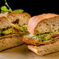 Milanesa Torta · Traditional Mexican street sandwich served on telera bread with refried bean spread.  Breade...