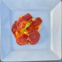 Cheese Ravioli · Made with our homemade Marinara and comes with a side of Garlic Bread.
