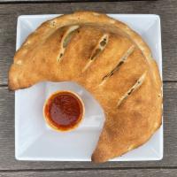 NY Calzone · Mozzarella, ricotta, and parmesan cheese; folded in pizza dough and baked to perfection! Com...