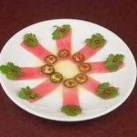 RAZOR /TUNA · Thinly sliced tuna, topped with cilantro, serrano chilies, sriracha sauce finished with yuzu...
