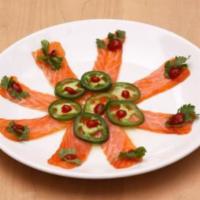 RAZOR SALMON · Thinly sliced Salmon, topped with cilantro, jalapenos, sriracha and finished with yuzu.